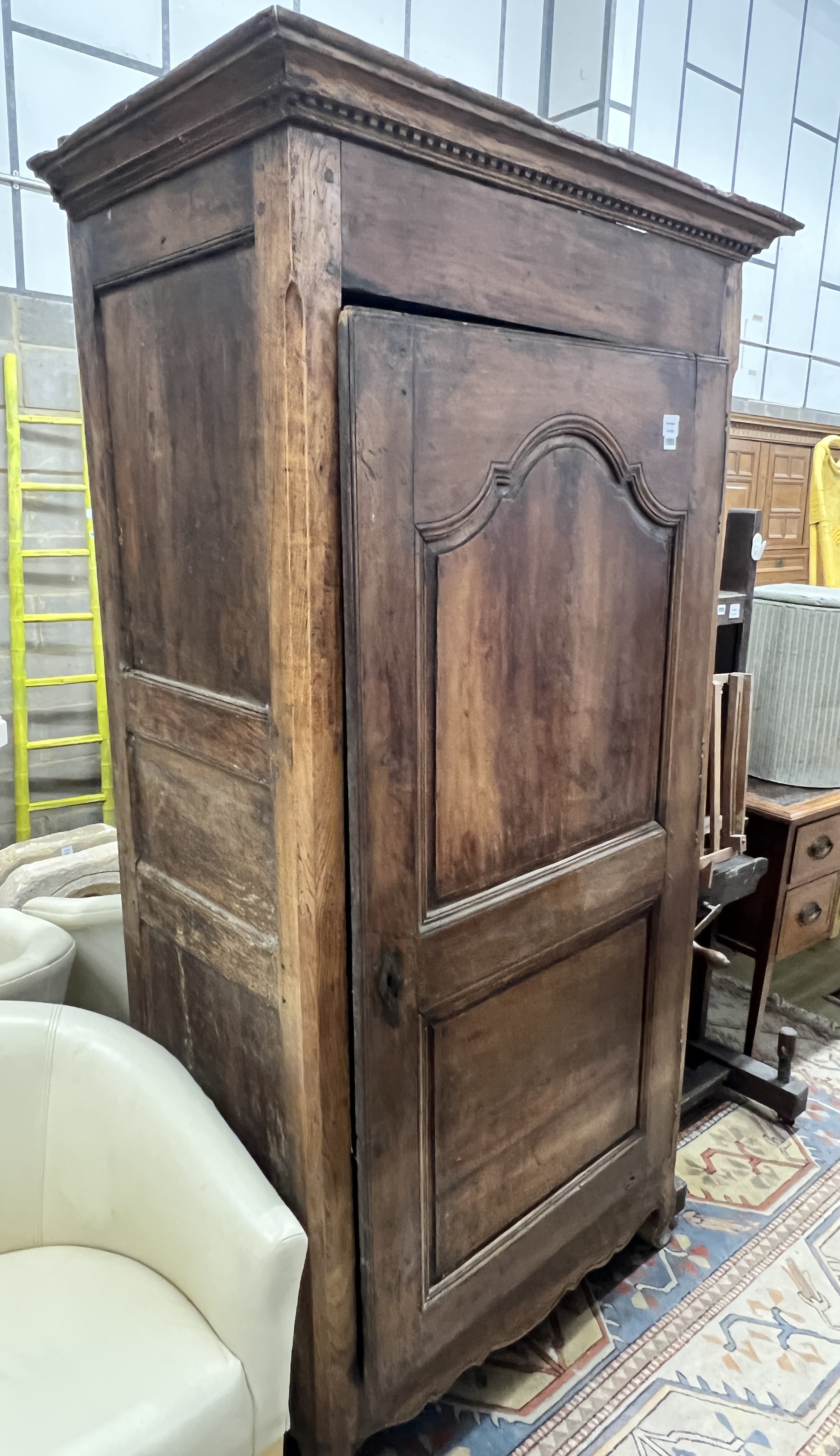 An 18th century French provincial fruitwood single door armoire, length 106cm, depth 62cm, height 198cm